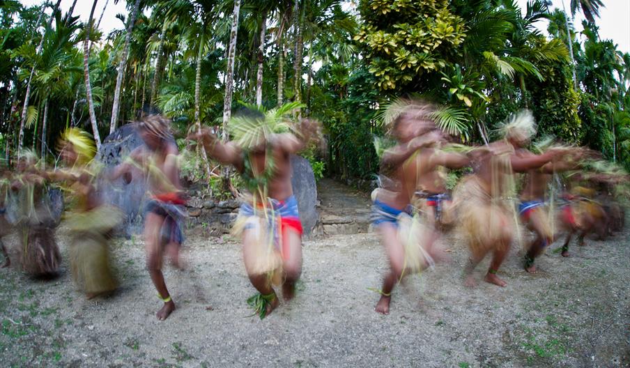 Traditional dancers on South Pacific Island participating in cultural tourism