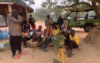 Hot Music in the Park, Mabuka Community group busking in Queen Elizabeth National Park Uganda