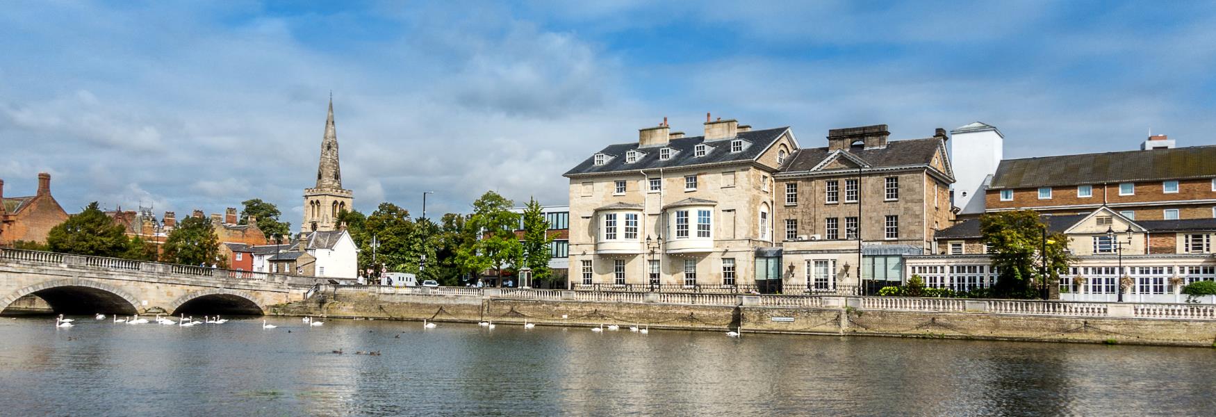 image shows riverside buildings