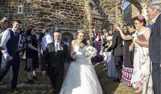 married couple leaving the church