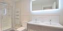 Walk in shower and led mirror at harper luxe apartment