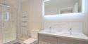 Walk in shower and led mirror at harper luxe apartment