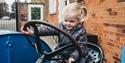 child on tractor