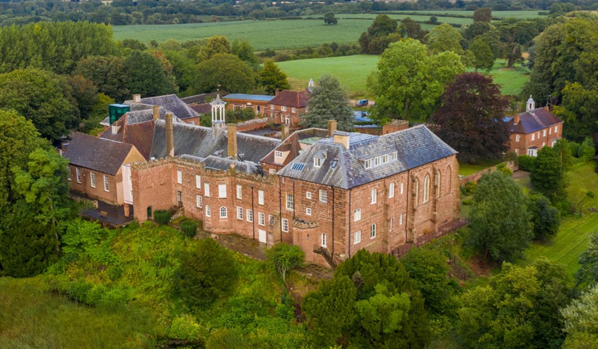 A photo of Hartlebury Castle from above, showing the nature reserve.