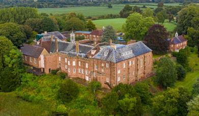 A photo of Hartlebury Castle from above, showing the nature reserve.
