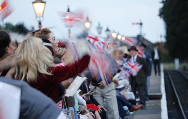 Crowd waving British Flags on Kidderminster Platform
