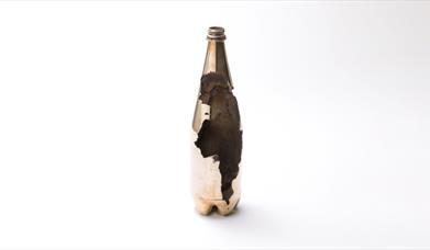 Dion Kitson, Burn Out (2023). Bronze Frosty Jack Cider bottle. Image courtesy the artist. Photographer, Steve Russell Studios