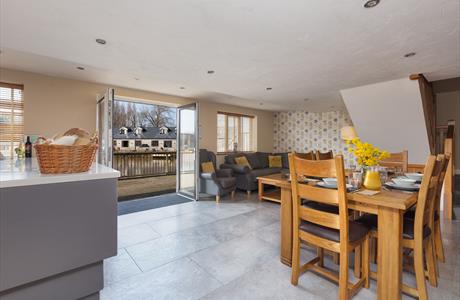 Open living space decorated in orange and white