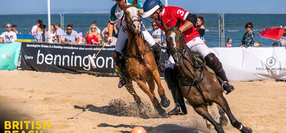 Polo players on Sandbanks Beach during a match