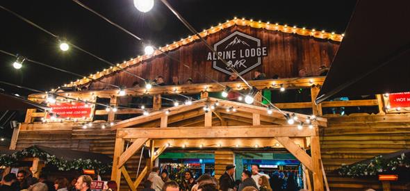 Visitors enjoying outdoor drinks at the Apline Lodge Bar in bournemouth