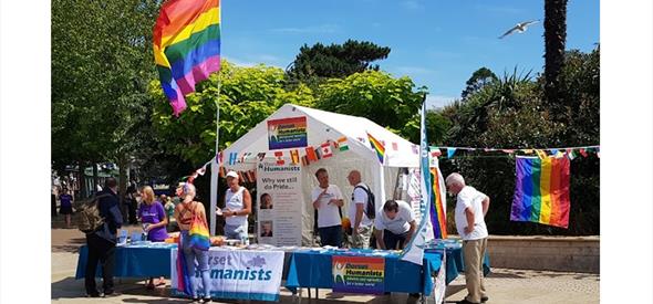 Photo of Dorset Humanists Information Tent with people