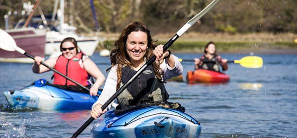 lady smiling whilst in a kayak 