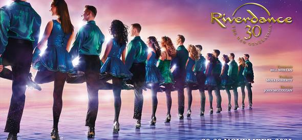 Riverdance group in a line looking away from the camera