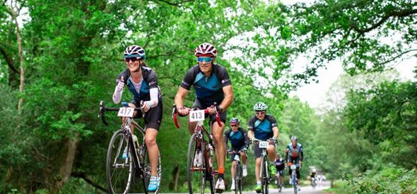 Group of cyclists riding on the road for Garmin Ride out