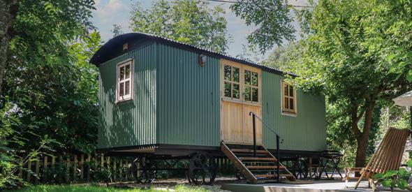 A happy hut from UK lodges set in a tree copse