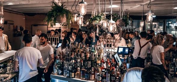 People enjoying themselves in a bar.