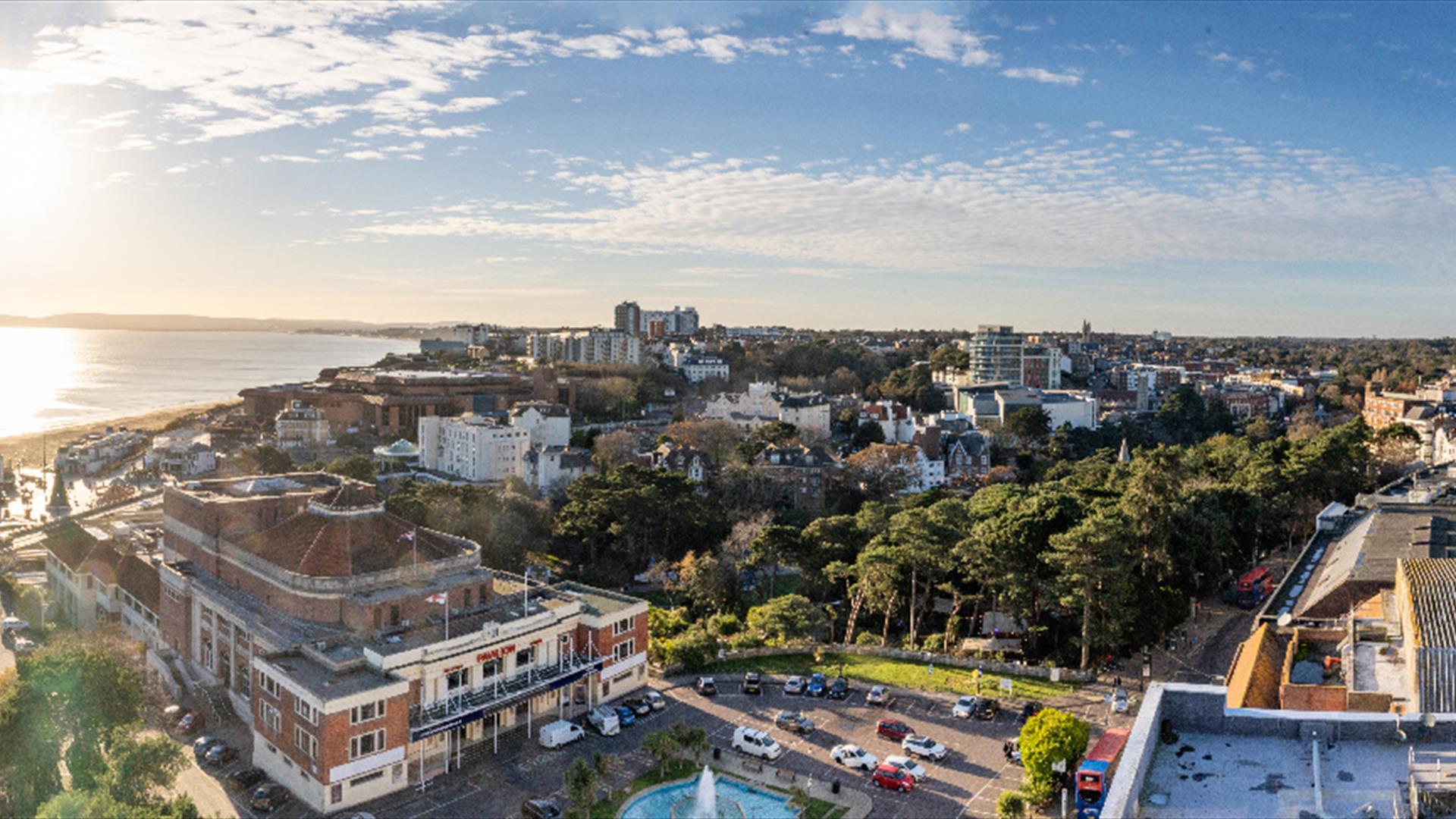 Panoramic image of Bournemouth town and the sun rise over the coastline taken from the top of a building