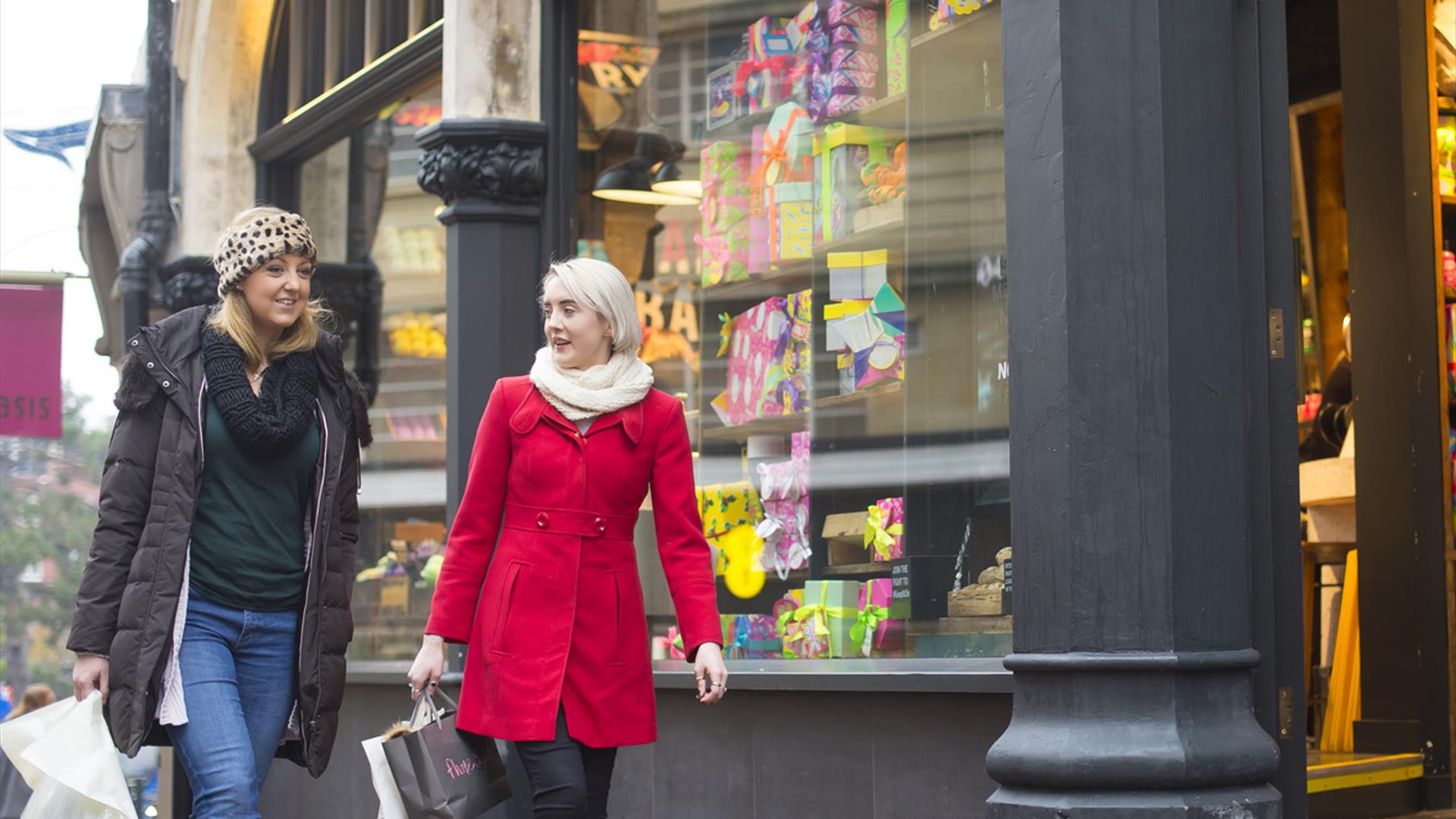 Two women wrapped up warm whilst shoping in Bournemouth