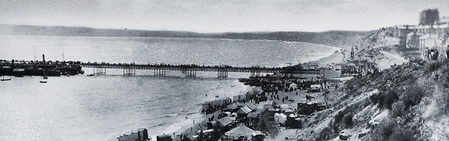 Bournemouth East Beach year 1890. Amusement Fair, bathing huts and horses on the beach
