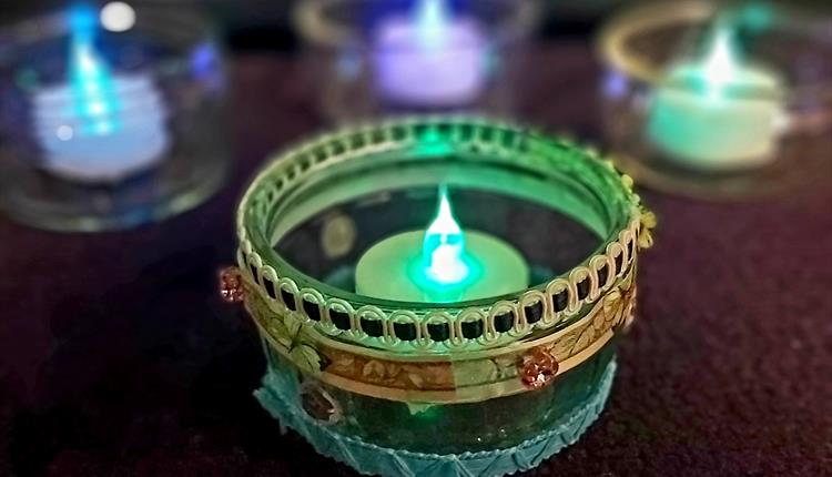 A Diwali tealight holder with LED light inside