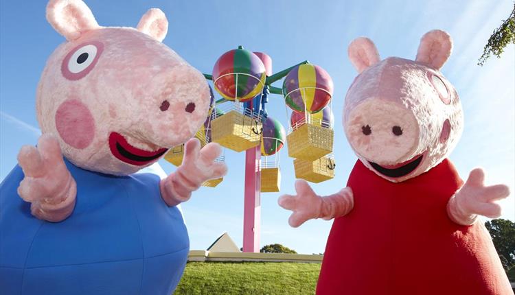 Peppa Pig and her brother pig having fun at Peppa Pig world