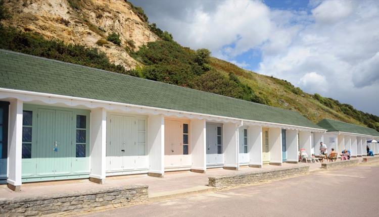 The colourful array of beach huts along alum chine beach