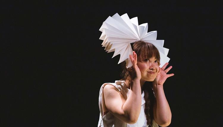 Asian lady with paper hat on