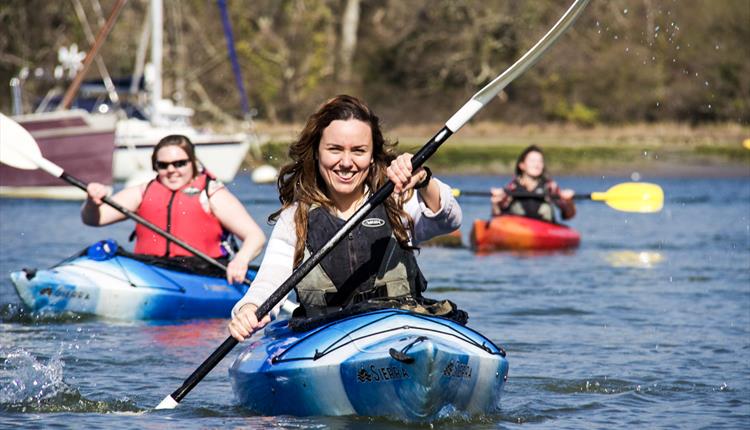 lady smiling whilst in a kayak