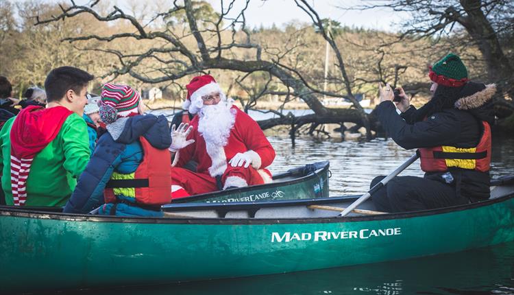 Children enjoying a paddle to meet Santa