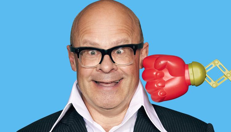 Image of Harry Hill, with a boxing glove about to hit him