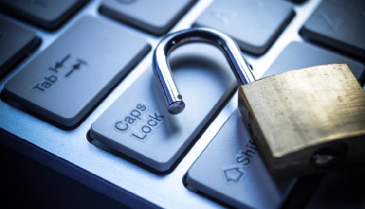 Close up of computer keyboard with a padlock on