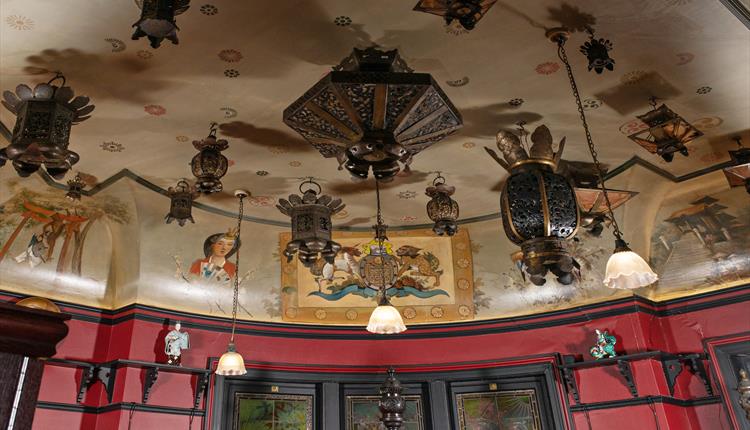 japanese lantern hanging from a decorated ceiling