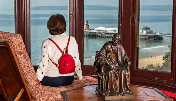 Woman looking out over Bournemouth Pier