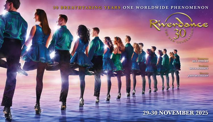 Riverdance group in a line looking away from the camera