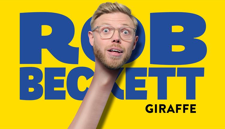 Photo of Rob in a comedy pose - looks like he has a long neck!