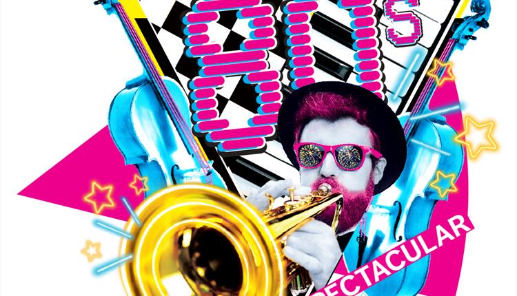 The concert title is written in a retro 80s font and a man is stood playing the trumpet surrounded by other instruments