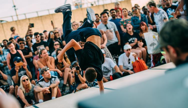 Dancer performing in front of a crowd