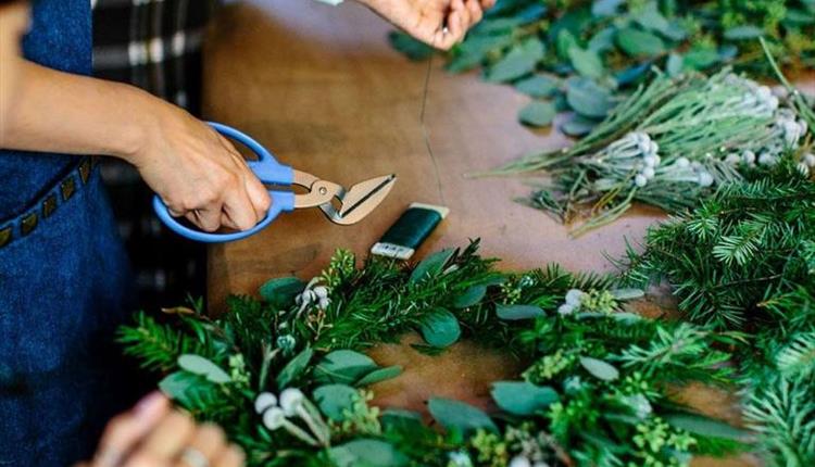 Making Christmas wreaths at Upton House with lovely dark green foliage.