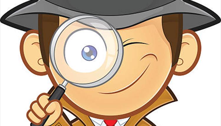 A detective in a brown coat and hat, holding up a magnifying glass to his eye