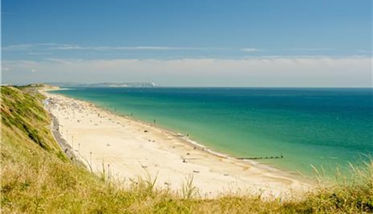 Views of southbourne beach and the blue sea taken from the overcliff on a sunny day