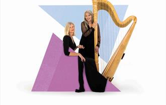 Two musicians are stood behind graphic triangles and to the right of them is a harp.