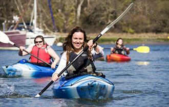 lady smiling whilst in a kayak