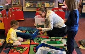 Lego Club, mother and children.
