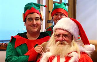 Father Christmas and his elves