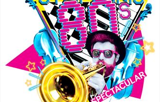 The concert title is written in a retro 80s font and a man is stood playing the trumpet surrounded by other instruments