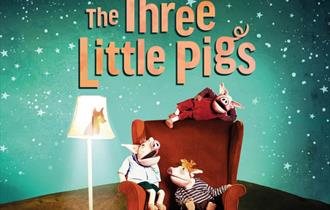 Three Little Pigs on a red chair with a starry night background