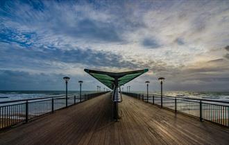 Moody skies over Boscombe pier in Bournemouth