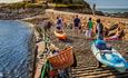 People walking along a sea wall