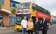 Yellow bus with union jack on