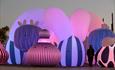 Pink hue lights up the inflatable art display